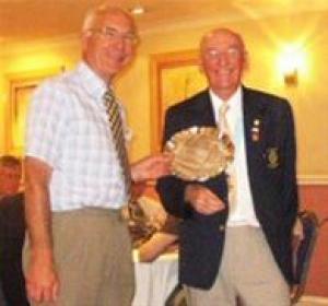 President Ian Saunders receives the Fred Longden Award from Rotary District 1050 Governor Ken Boylett